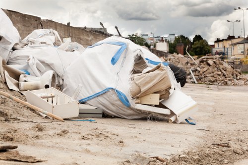 People clearing items from a loft space